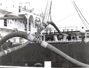 Photograph - Photograph - detailed view of ship loading petroleum, n.d