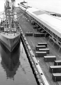 Photograph - Photograph - containers of goods awaiting loading onto ship, 1980s