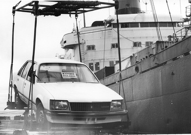 Photograph - Photograph Lifting Holden onto ship with crane for export, n.d