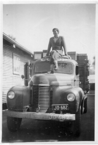 Photograph - Digital Image, Girl on delivery truck at Greensborough co-op, 1950c