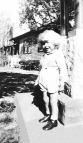Photograph - Digital image, Lin Lobb sitting on the War Memorial, 1945c