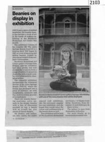 Newspaper clipping, Beanies on display in exhibition, 03/12/2014
