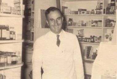 Photograph - Digital image, Tom Vickers in his chemist shop, 1960s