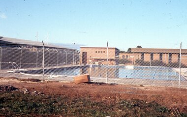 Photograph - Digital Image, Watsonia High School Pool, Construction 1976. Pool behind fence, 12/12/1976