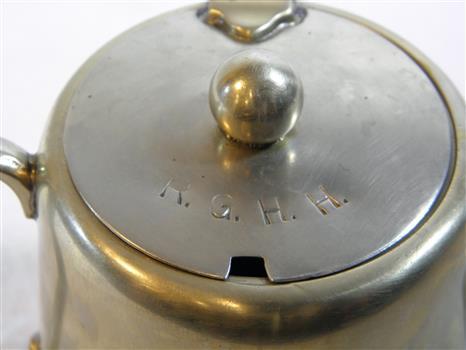 Double handled sugar bowl with hinged lid, teapot style. Cut for spoon. Embossed: R.G.H.H.