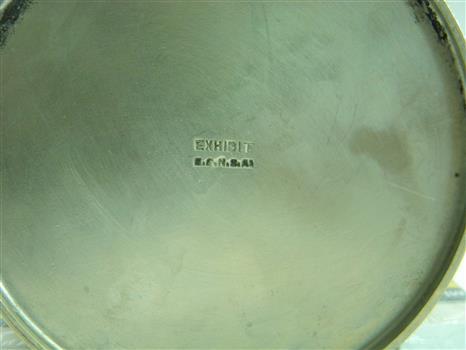 Base of sugar bowl embossed with: EXHIBIT