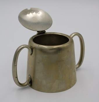 Double handled sugar bowl with hinged lid, teapot style. Cut for spoon. Embossed: R.G.H.H.