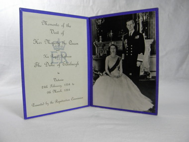 Two sided with image of the Queen and Prince Philip on one side with text  on the other.  
