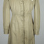 Cream coloured cotton, long sleeve, button-up nurses uniform, with small Red Cross white patch on left side. 