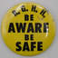 Round button badge, yellow background with black text