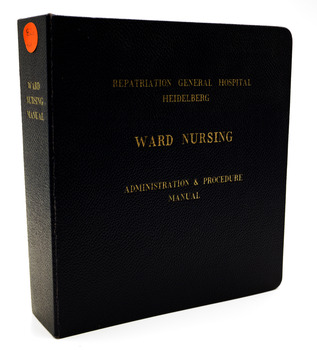 Navy blue hard cover binder with gold embossed lettering. On white background