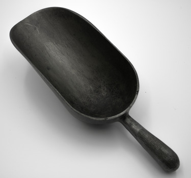 Metal scoop with handle commonly used in industrial kitchens.
