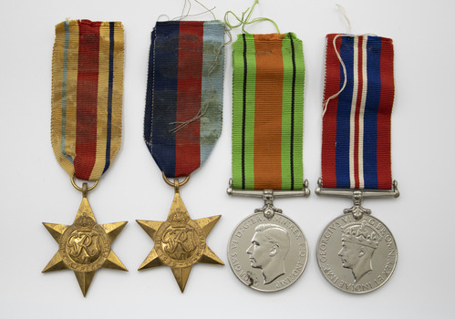 Set of original WWII Medals: L-R 1939-1945 Star; Africa Star, 1939-1945 Defence Medal, 1939-1945 War Medal