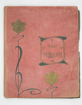 Red cover with flowers and the words Scrap Album