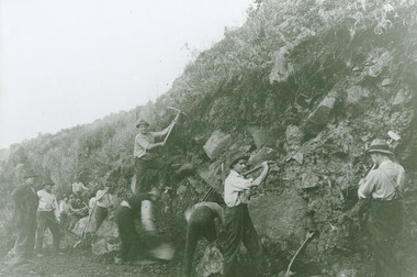 Workers on Great Ocean Road with picks and shovels
