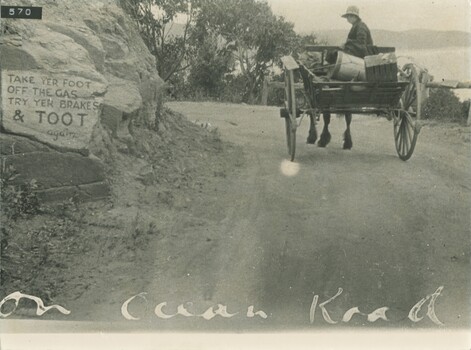 Horse and dray on GOR with sign written on rock 