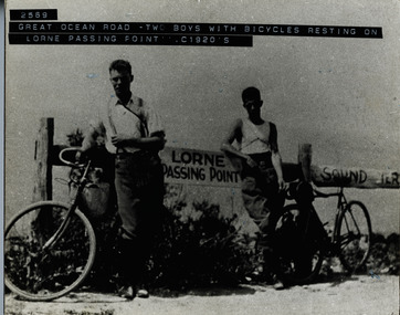 Two boys with bicycles resting at Lorne passing point 1920's