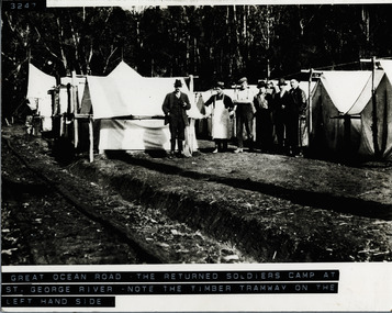 Returned soldiers outside tents at workers camp for GOR at St George River - remains of wooded tramway visible on left of photo