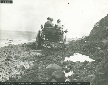 Car on muddy section of GOR pre- construction of road