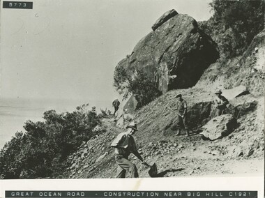 Four workers with ahnd tools at Big Hill on Great Ocean Road c 1921