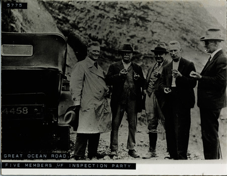 Five members of Great Ocean Road inspection team standing beside car