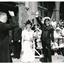 H.R.H. Duchess Alice of Gloucester standing next to Padre Frank Oliver saluting the crowd during a Royal visit to Mission to Seamen