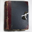 Thick scrapbook collecting newspaper clippings and images