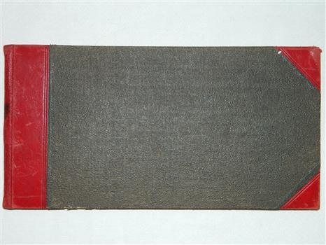Large register of funerals with dark cover and red leather binding at spine and corners.