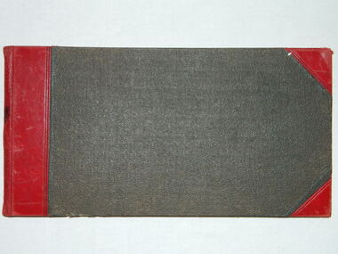 Large register of funerals with dark cover and red leather binding at spine and corners.