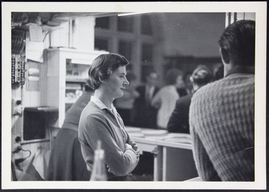 Photograph - Photograph, Black and white, Young woman helping at the bar at Mission to Seafarers, c. 1950