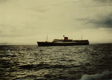 A colour photograph of the ocean and a ship - the Cape Town Castle - off the coast of Cape Colony, dated 29-2-48.