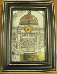Small framed commemorative collage depicting the Flinders Street station with a commemorative WWI coin