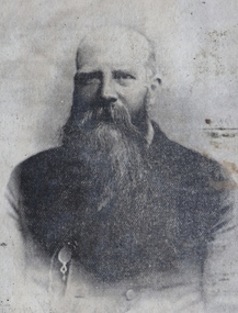 Black and white photograph of man with long beard