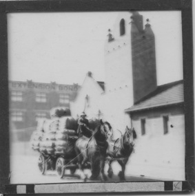 Slide - Glass slide, Black and white, Mission to seamen building, Flinders St and loaded horse-drawn wagon, circa 1920s