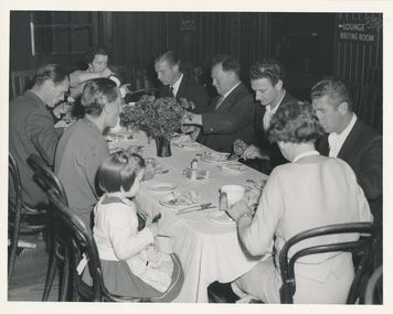 Group of seamen and ladies from the Guild during dinner at the Mission