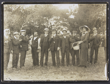 Photograph, Joan Bagot distributes fruit at picnic