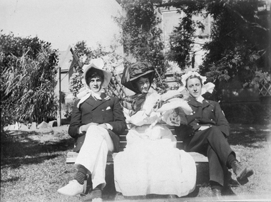 Photograph, Two seamen dressed up and a lady sitting on chairs