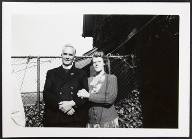 Photograph, Padre Oliver and wife Moira in the mission's garden, circa 1958