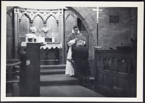 Young priest [David Kent] conducts a service in St Peter chapel