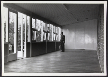 Photograph, Man holding a duster in unknown mission