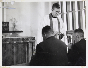 photograph - Photograph, Black and white, Reverend C.W. Reeves officiates at a service of Holy Communion in the Schiedam Mission, 1960's