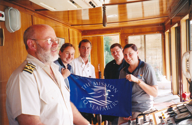 photograph - Photograph, Colour, Carrying the Mission's flag