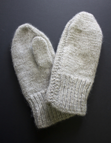 Pair of hand knitted mittens 