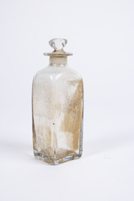 Clear glass  squared-base medicine container  with glass lid.
