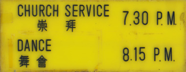 Yellow acrylic signage in Mandarin and English saying Church Service and Dance with time