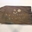 Side view of bag showing stencil inscription