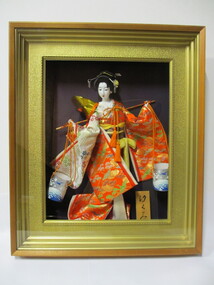 Framed doll