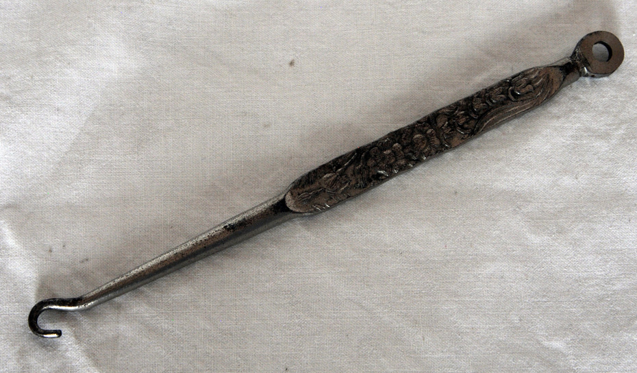 Antique buttonhooks and shoehorns. A buttonhook is a tool used to