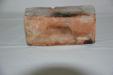 Functional object - brick with handprint, early 1900s