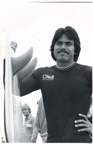 Photograph, Unknown, Reno Abellira Holding Twin Fin Surfboard, circa 1977
